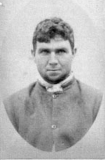 Detail of Brisbane Gaol Photograph and Criminal History of Patrick O'Dwyer, 1890.  Shows face and shoulders of a young man with short brown hair. He is wearing prison attire.