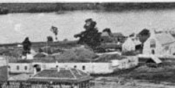 Photograph of the gaol building in 1862. St Stephen's is visible, and the Brisbane River is in the background.