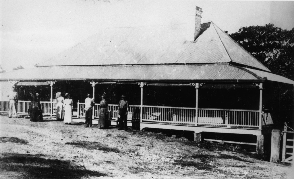 Large colonial home belonging to the Soden family situated in Ipswich Road, Annerley.  A group of people dressed in late Victorian clothing can be seen in front of the house.