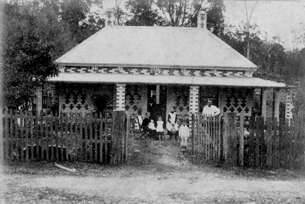 Family in front of Upton Cottage, 39 South Pine Road, Alderley, Brisbane, around 1889.